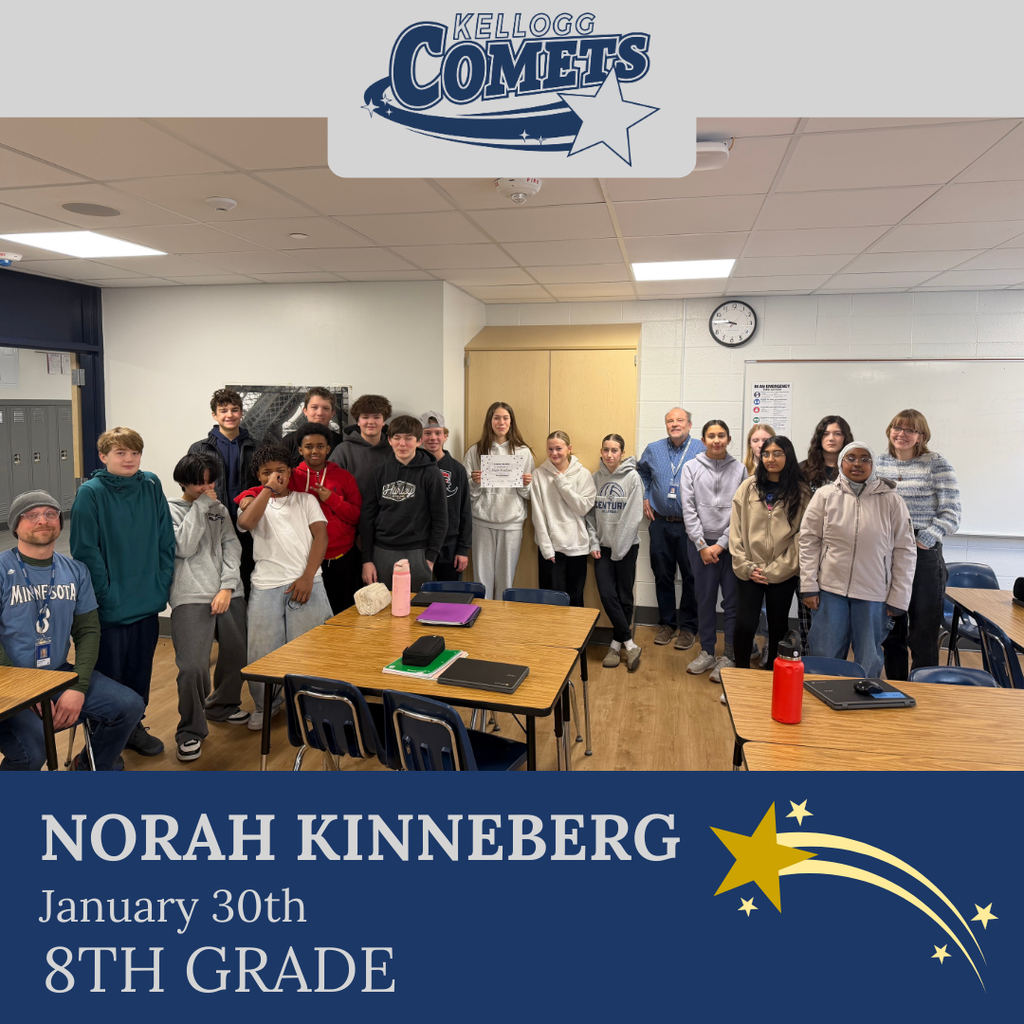 Group of students in multicolored clothing standing and smiling for a student who received award