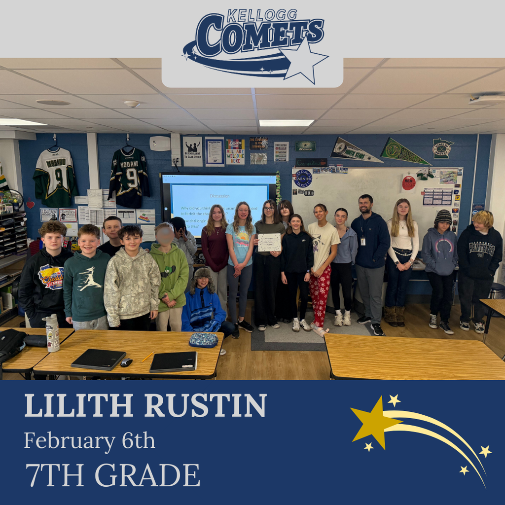 Group of students in multicolored clothing standing and smiling for a student who received award