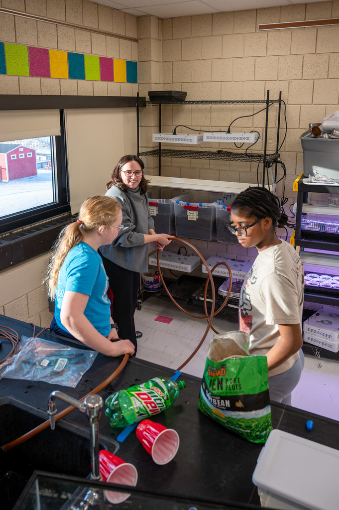 students testing hydration methods for plants