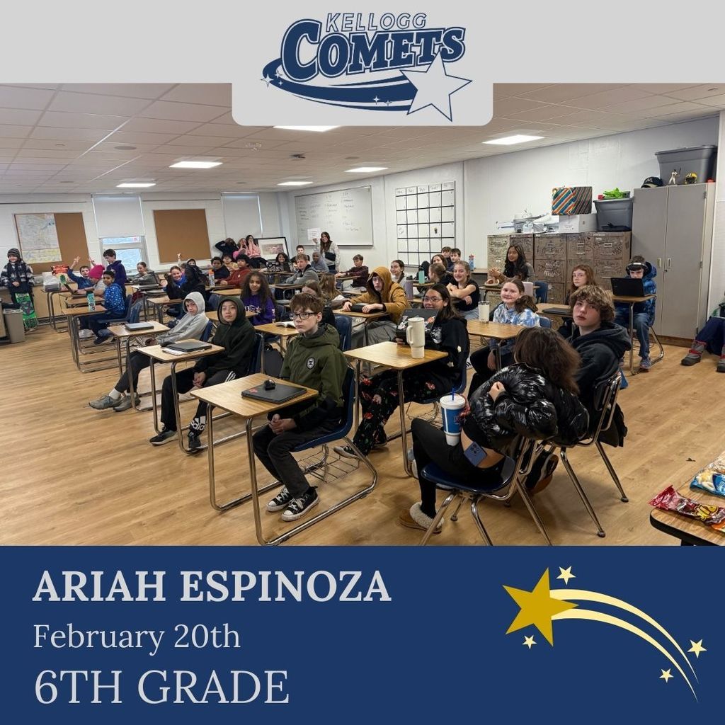 Group of students in multicolored clothing standing and smiling for a student who received award