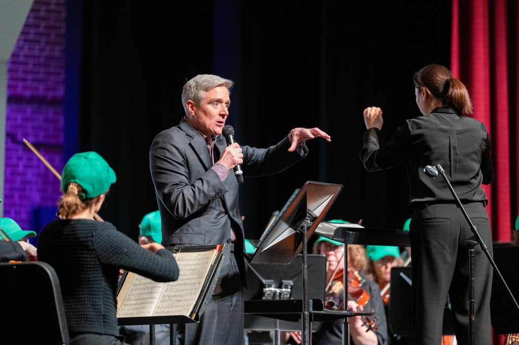Superintendent Pekel reading animatedly