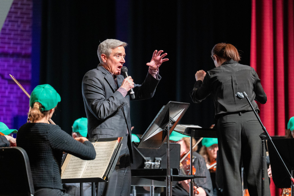 Superintendent Pekel reading animatedly