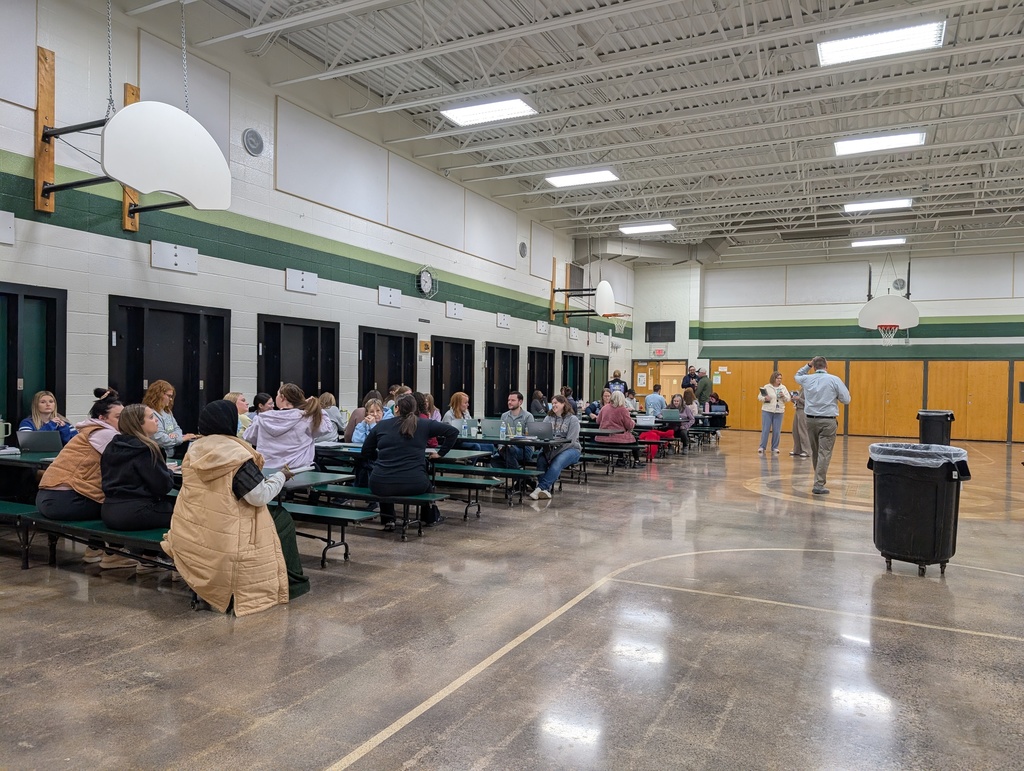 At Gage, staff participate in Curriculum and Development Day in the cafeteria.