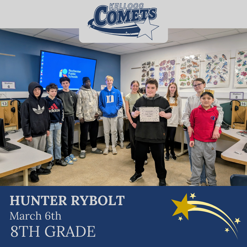 Group of students in multicolored clothing standing and smiling for a student who received award