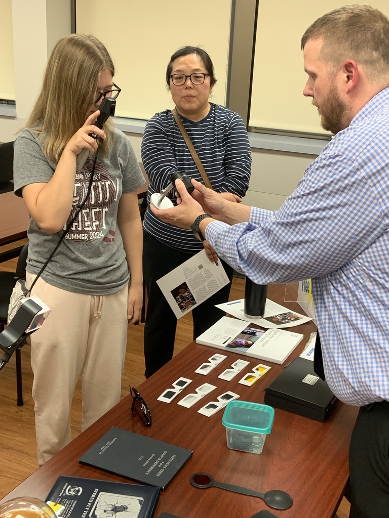 Instructor talking with student about optometry.