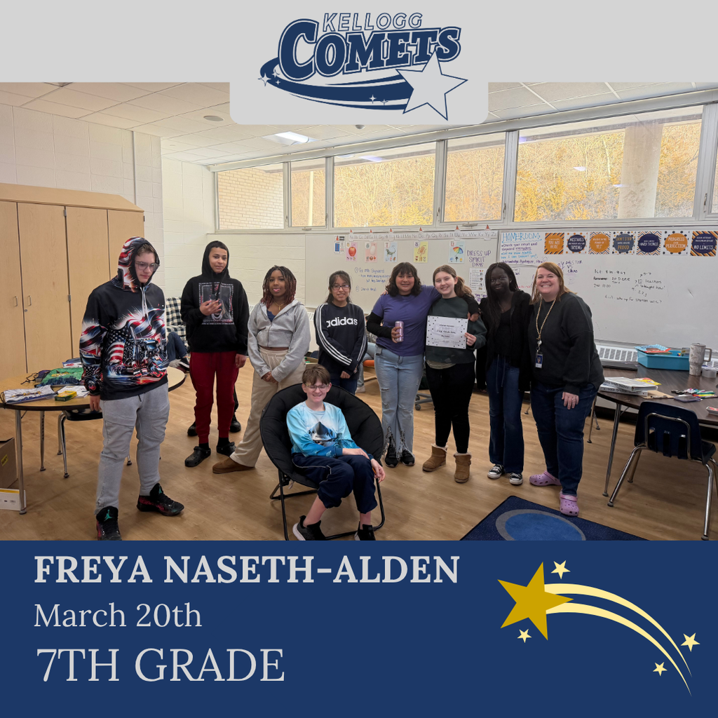 Group of students in multicolored clothing standing and smiling for a student who received award