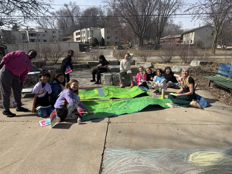 students outside doing art 