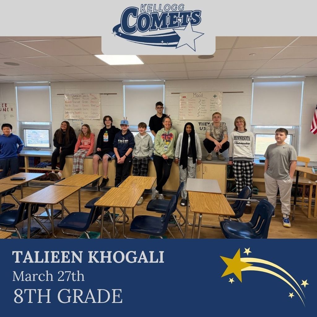 Group of students in multicolored clothing standing and smiling for a student who received award