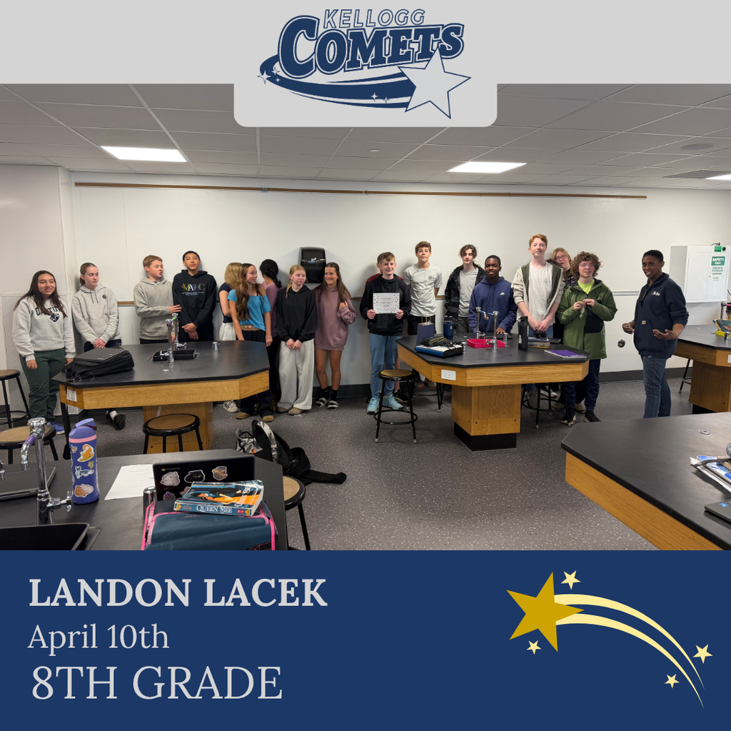 Group of students in multicolored clothing standing and smiling for a student who received award