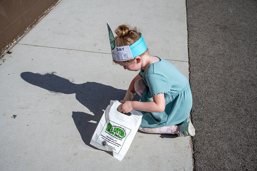 Student picking up trash