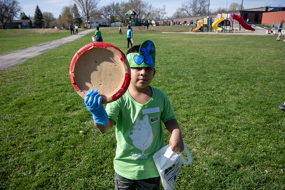 Student showing off trash he found