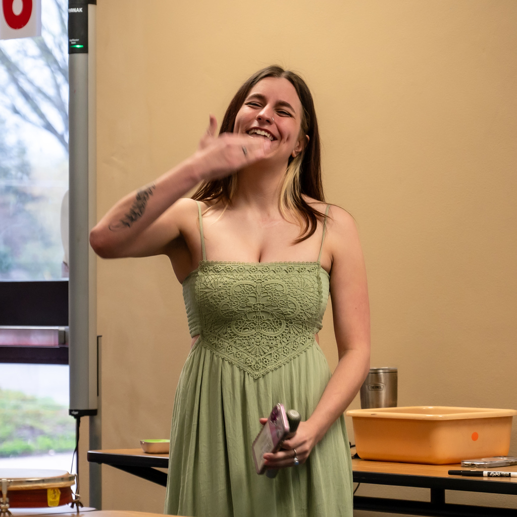 A high school senior finished her speech at the Annual Sertoma and DHH Breakfast by signing "thank you."