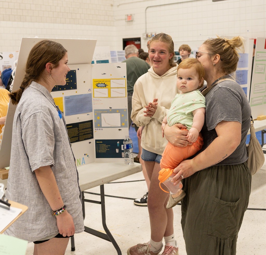 student explaining project