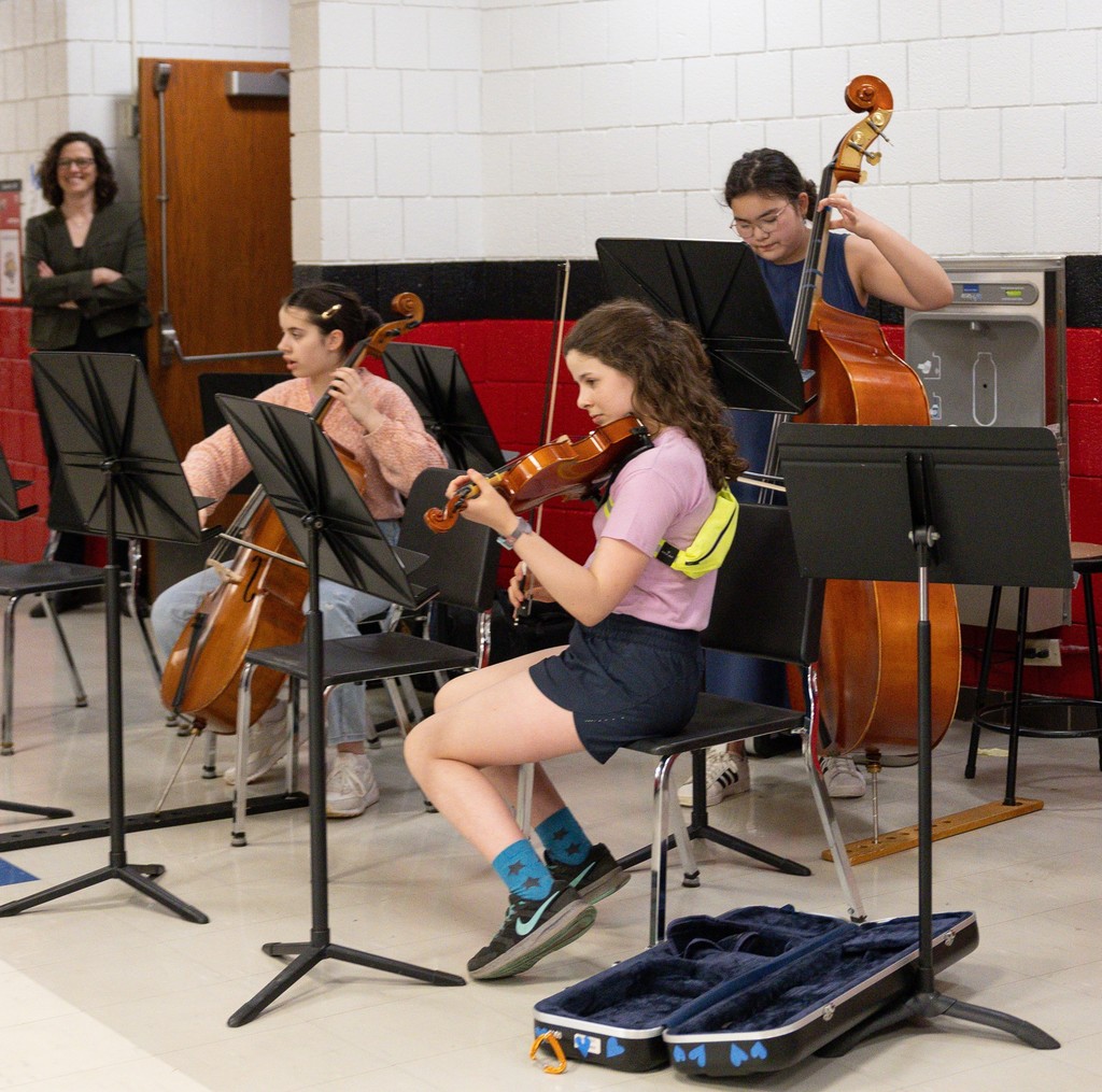 orchestra students performing