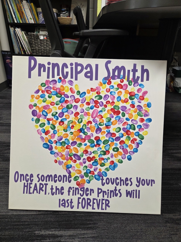 Our school community added their thumbprint to make this artwork for Mrs. Smith's office