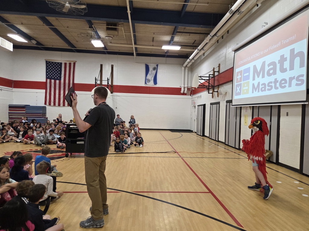 Mr. Olson honoring our Math Master teams and School Patrol