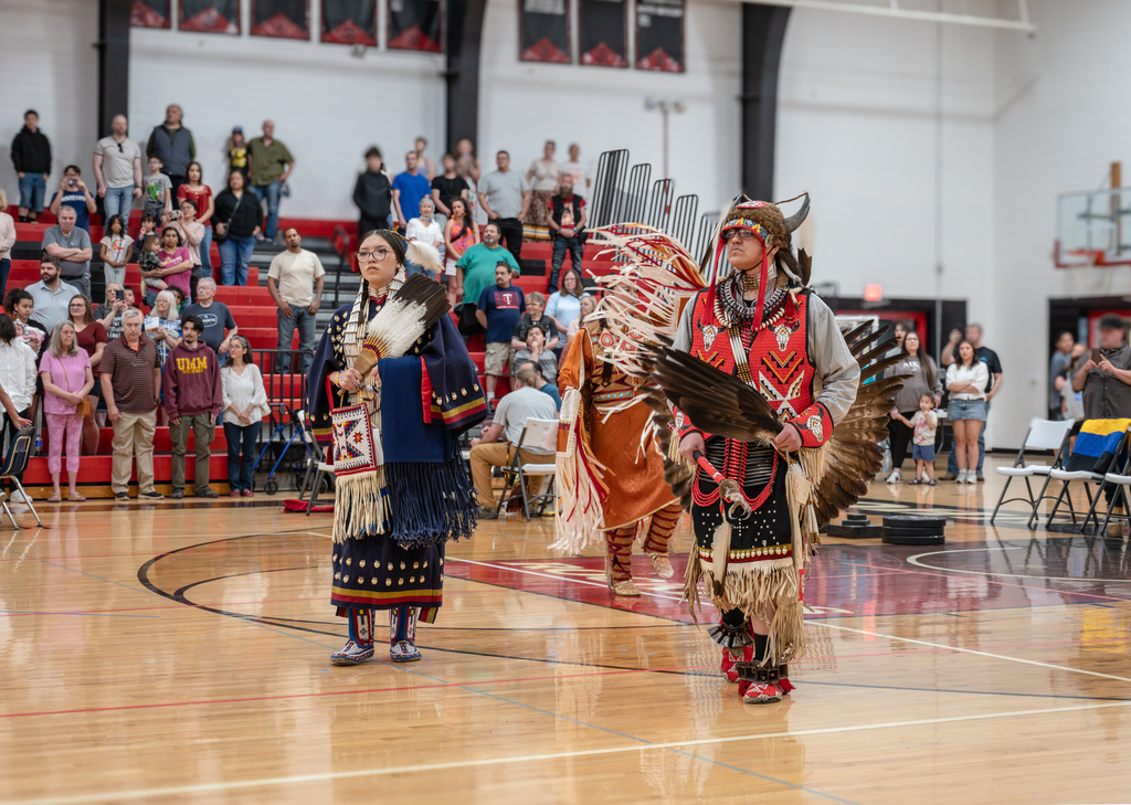 High school head dancers leading an Intertribal.