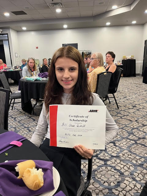 student with certificate