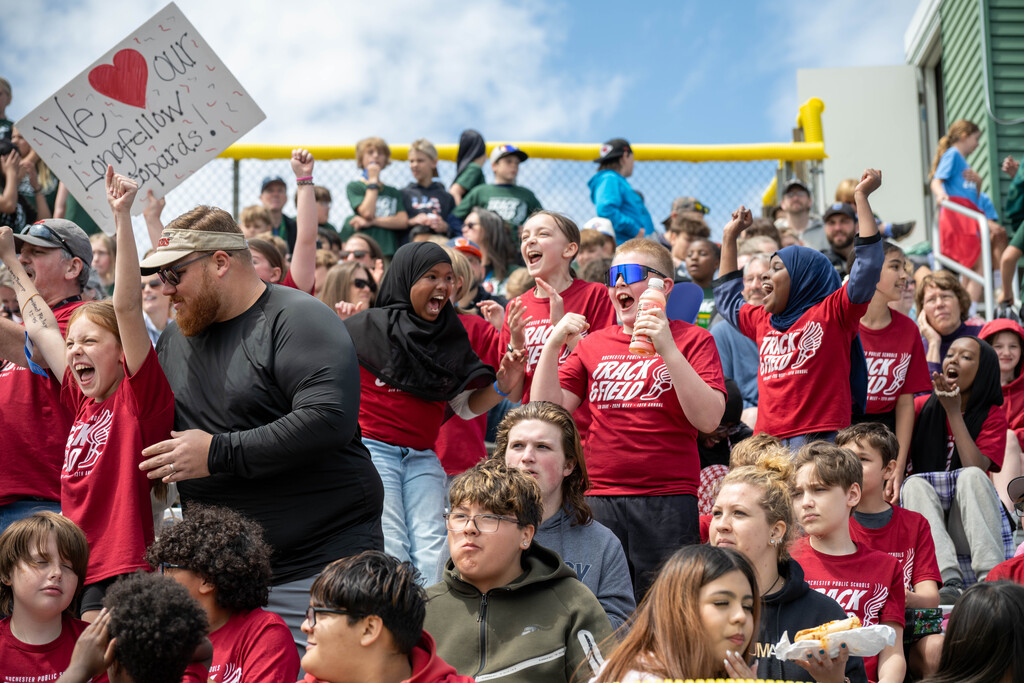 Group of students cheering as their peer wins the race!