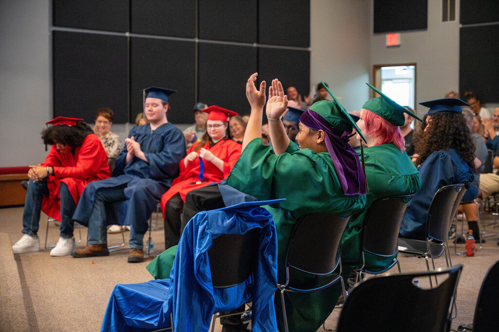 Leap graduates celebrate a peers accomplishment