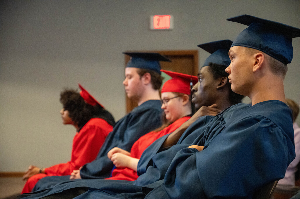 LEAP graduates listen to speakers congratulate them on their achievements