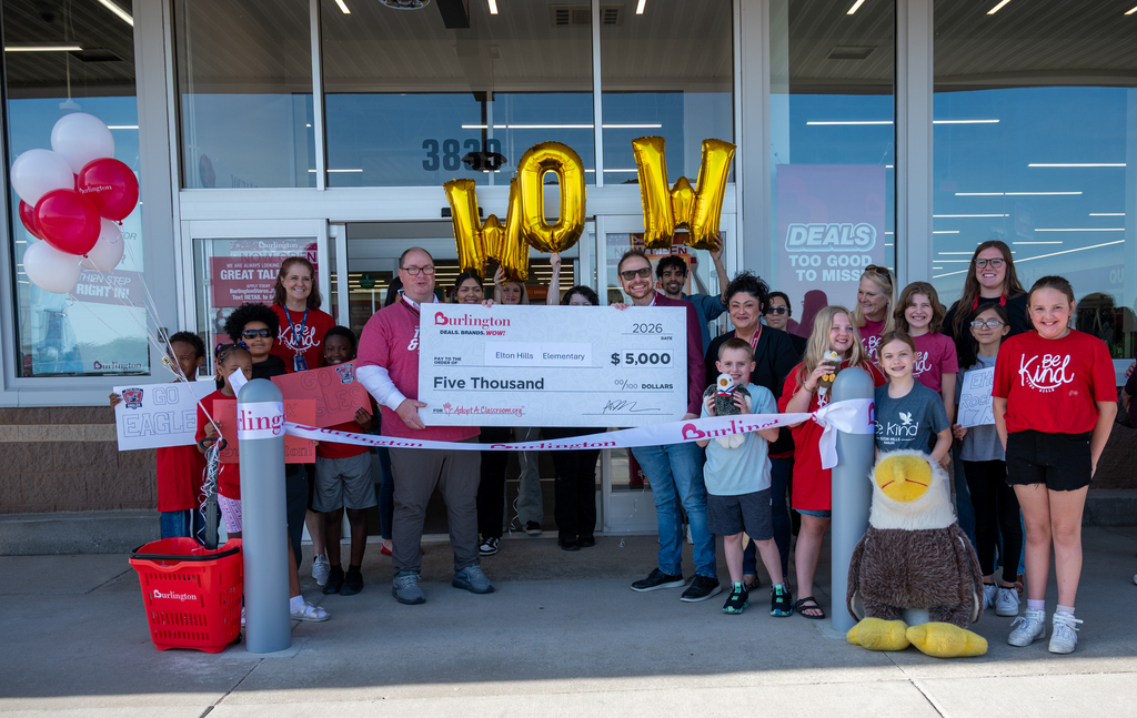 Elton Hills receiving the check