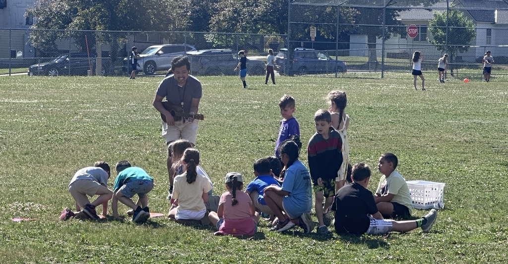 Teacher singing to students