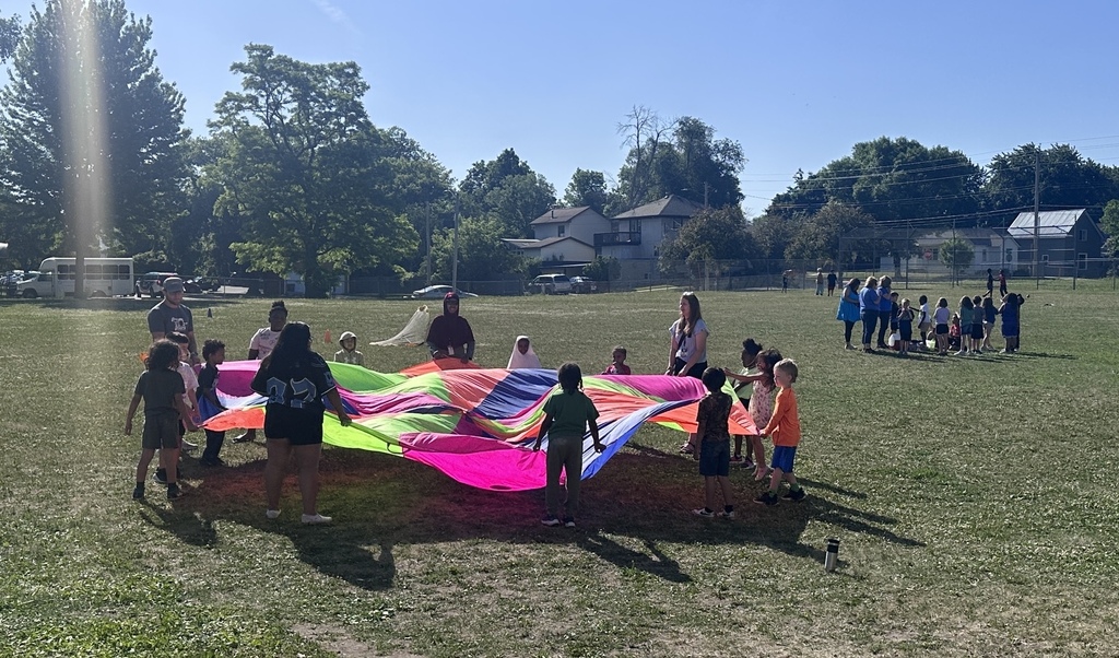 Children playing with a parachute