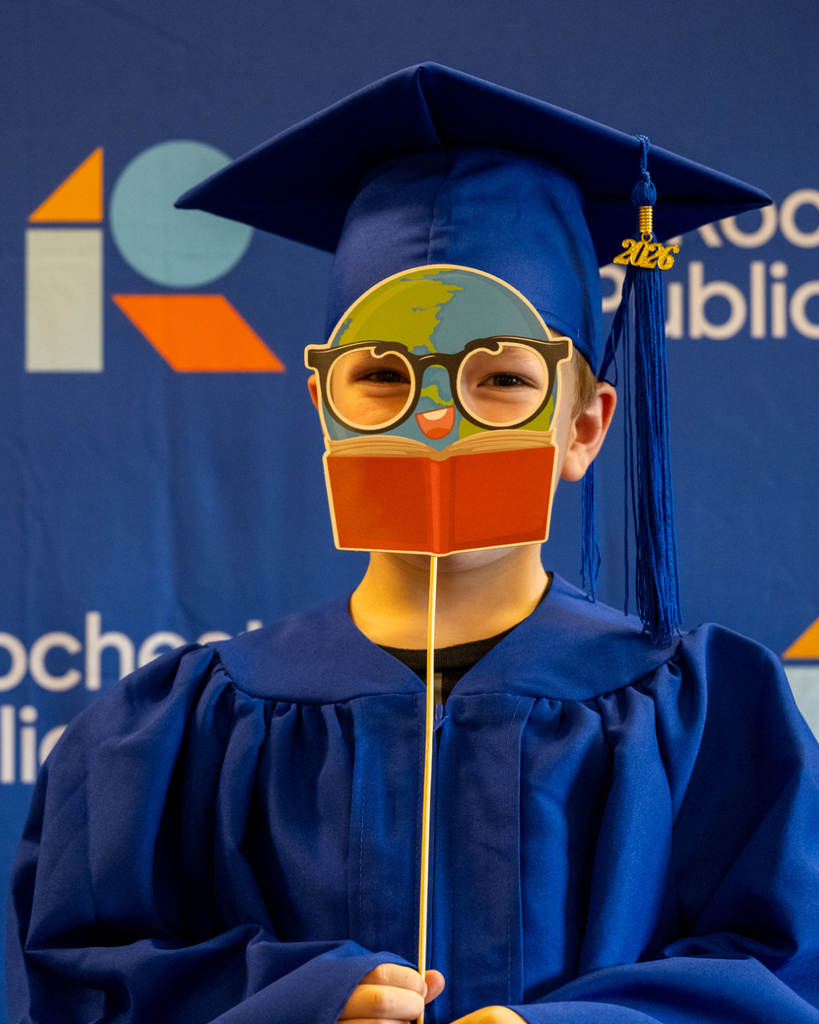 preschool graduate smiling at the camera
