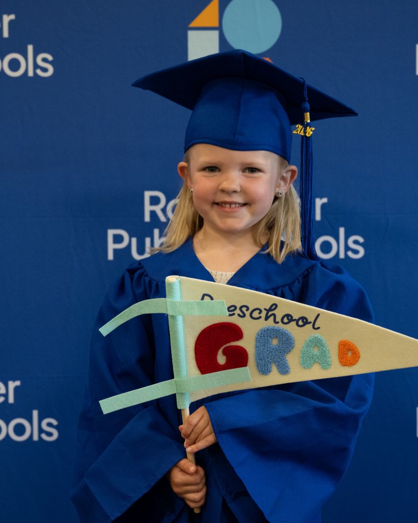 preschool graduate smiling at the camera