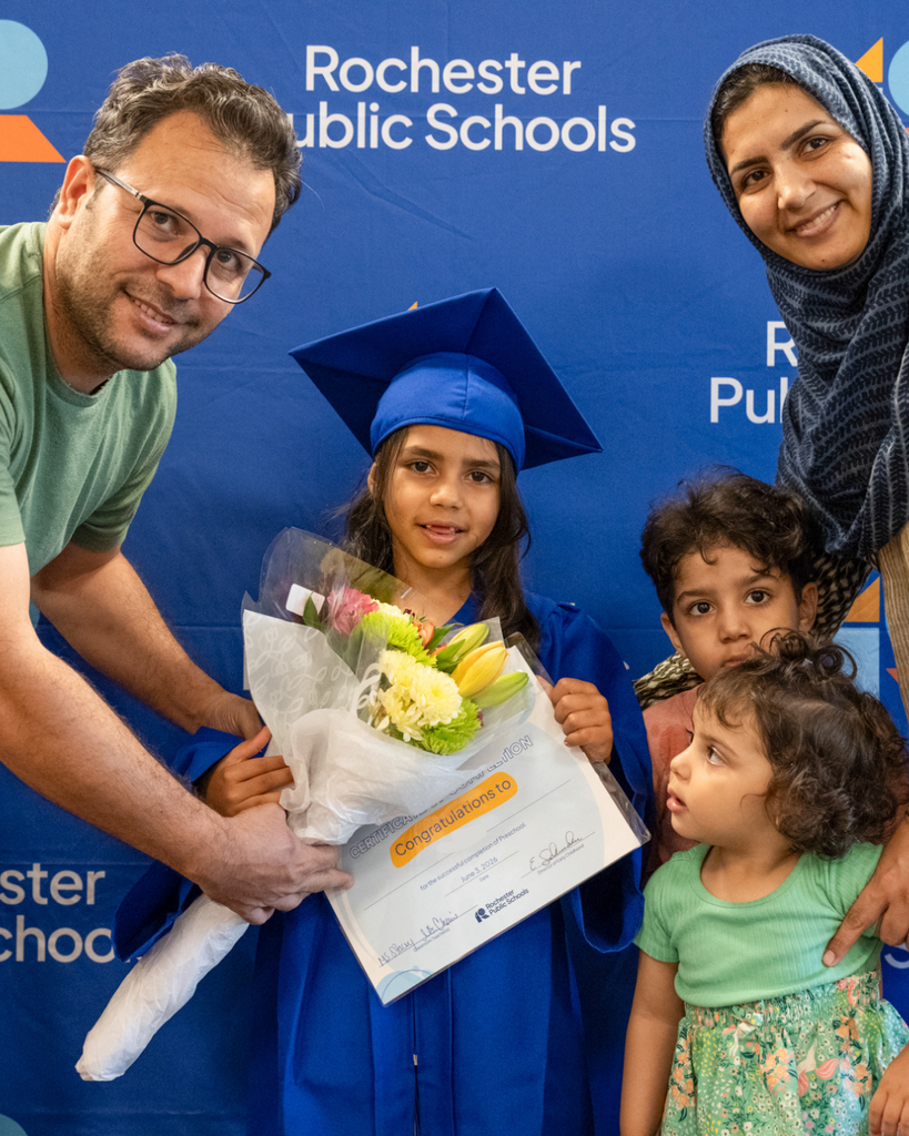 preschool graduate smiling at the camera