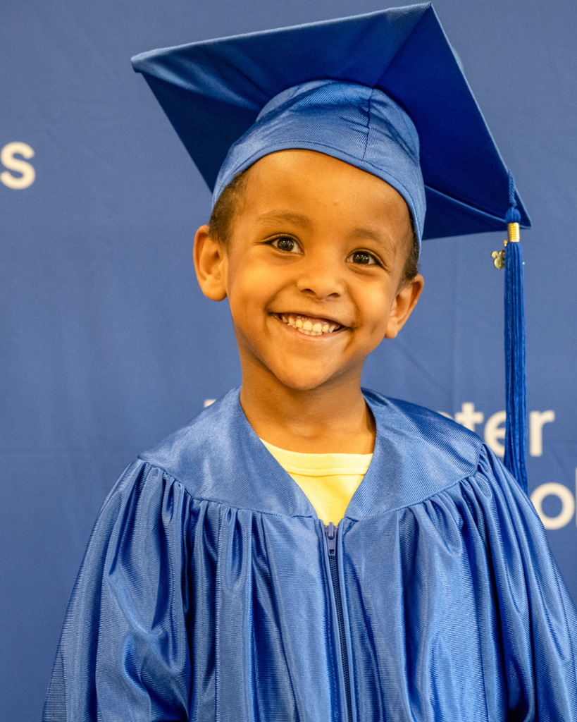 preschool graduate smiling at the camera