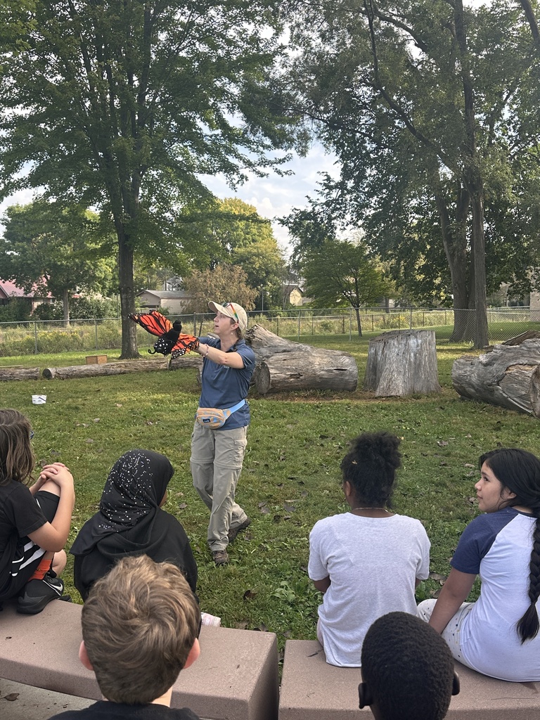 Teacher holding butterfly