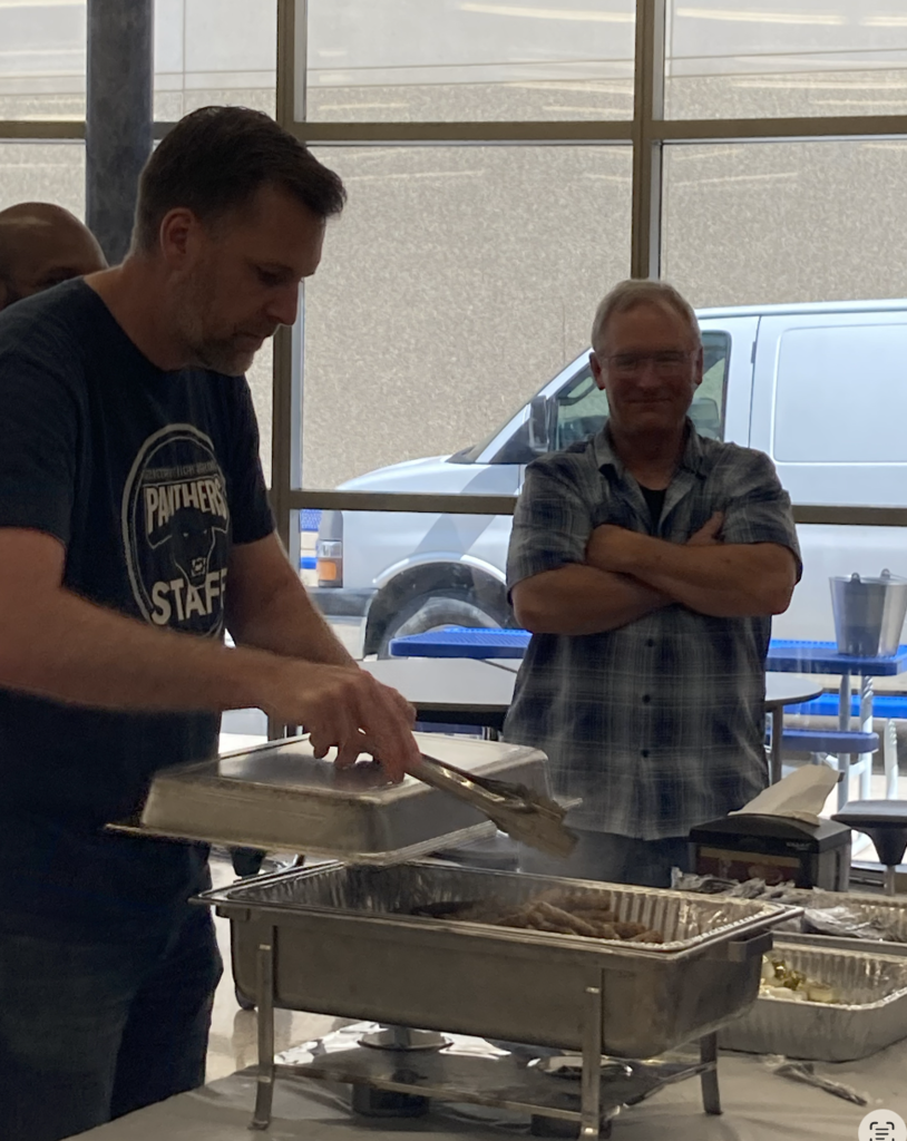 Mr. Dodds and Frutiger serve breakfast