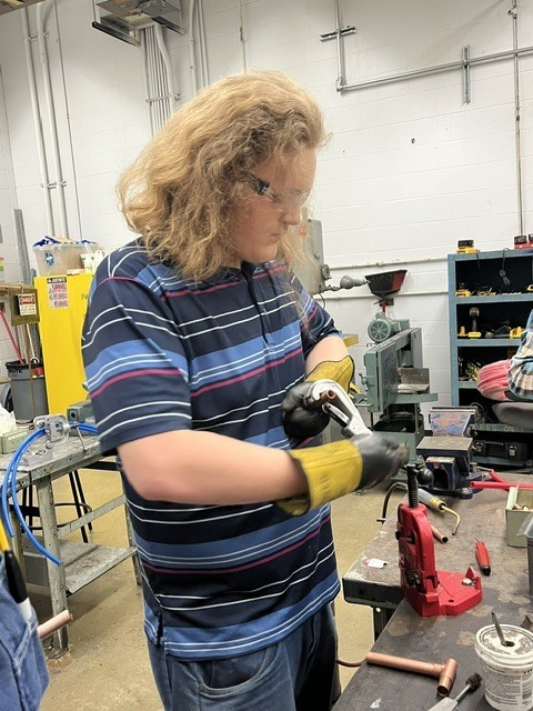 Jacob prepping for soldering 