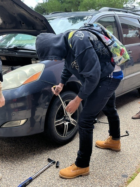 Jah'miz changing the tire