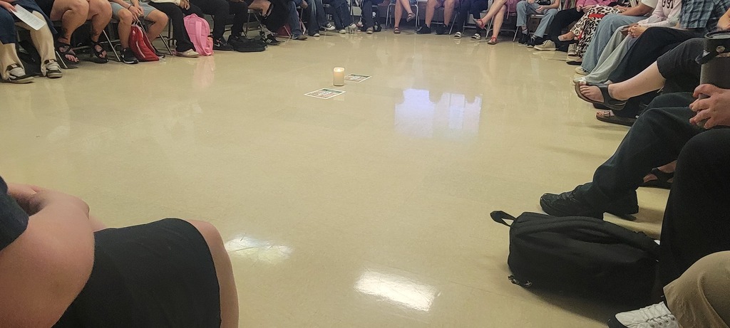 students/staff sitting in a circle