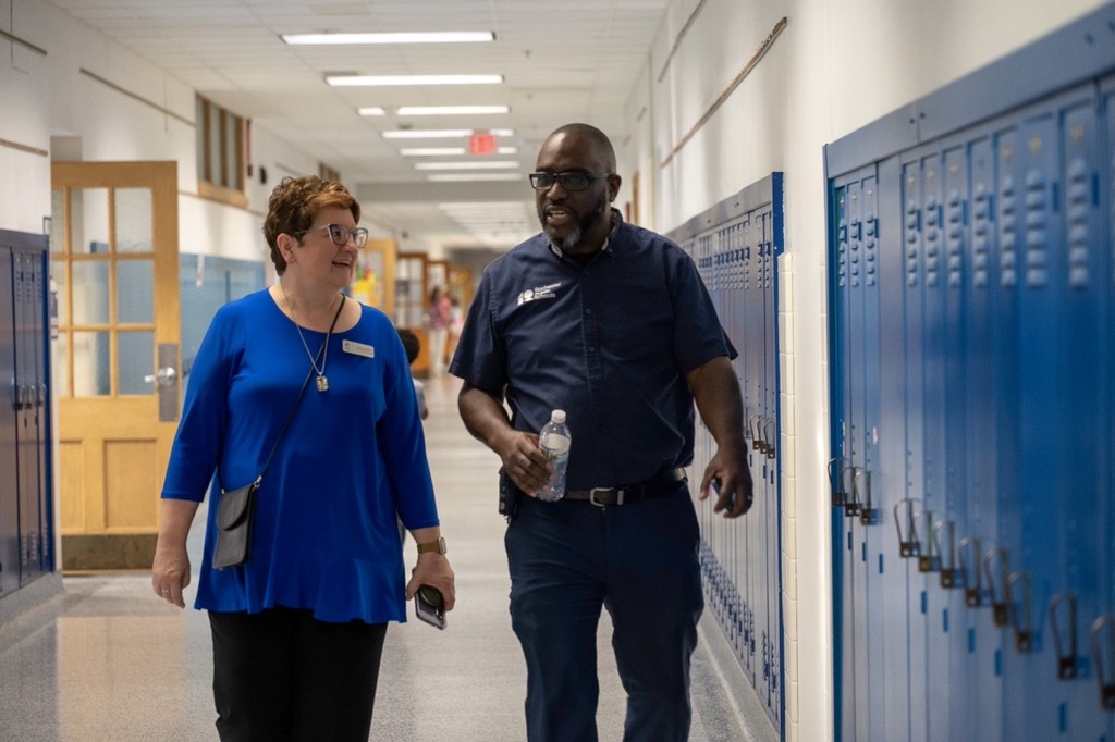 School Board Chair, Cathy Nathan talking with a staff member after the bell rang for Jefferson's first day.