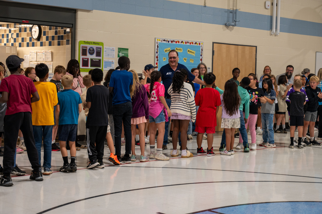 Mr. Denny receiving high fives