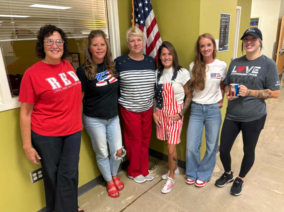 staff wearing red