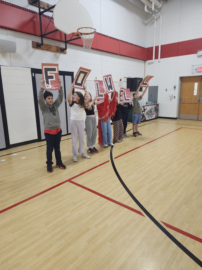 Singimg our school song at our new student assembly