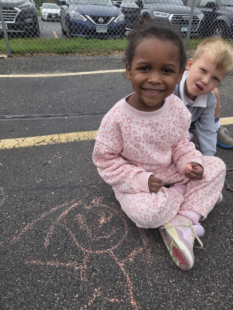 K artists with chalk art at recess
