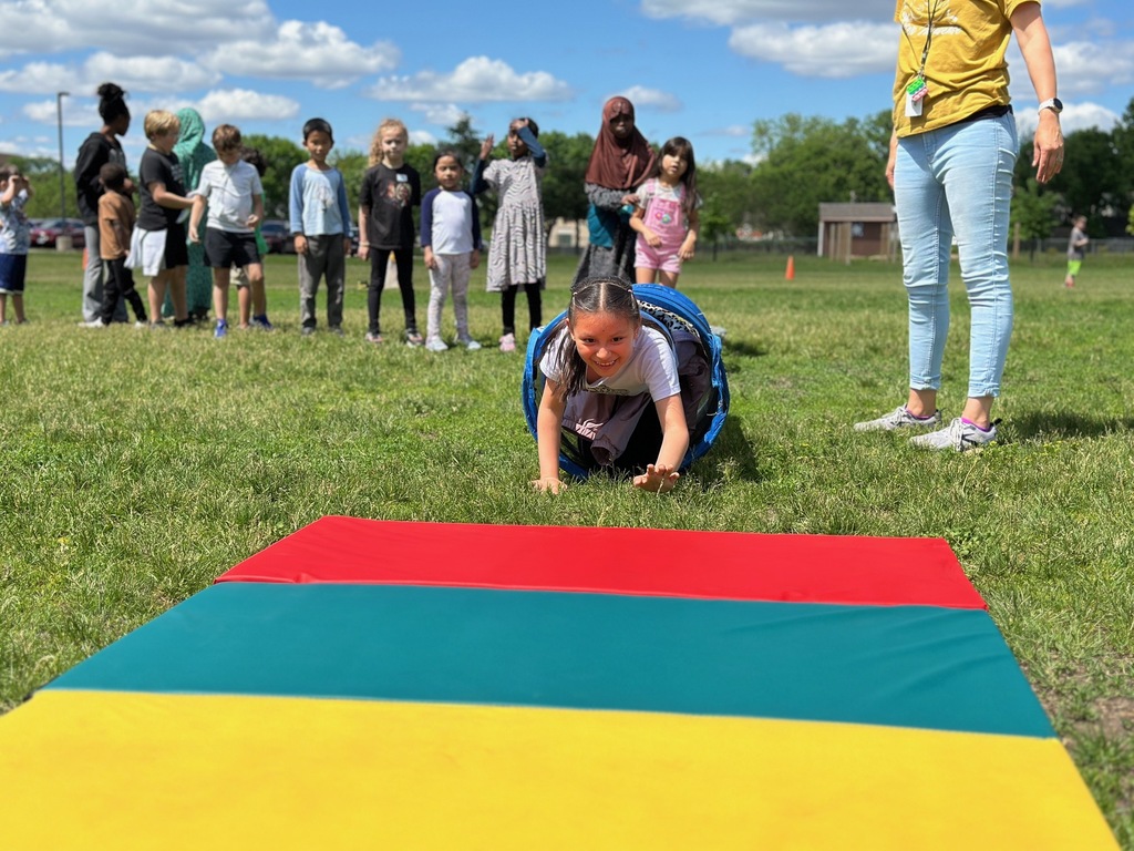 Child crawling through an obstacle course