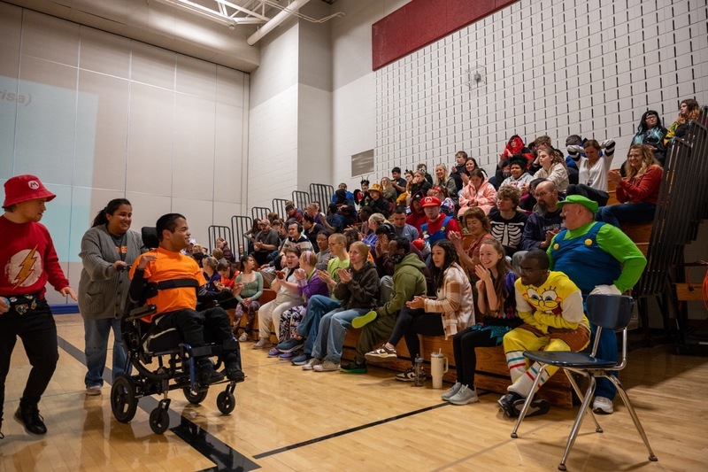 Jacob is cheered on by his classmates after dancing to “This Is How We Roll” by Florida Georgia Line with his teacher, Brisa