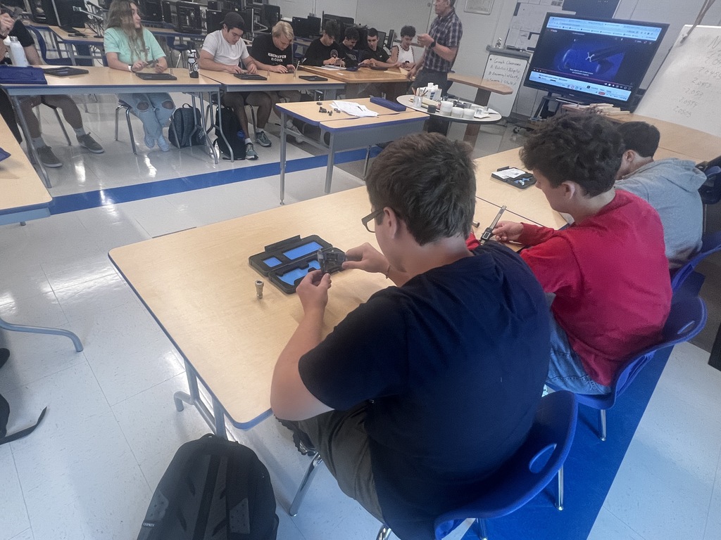 Engineering students calibrating tools 