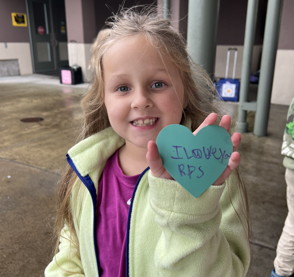 Student holding heart