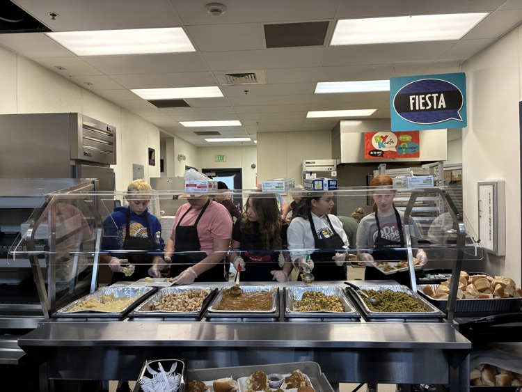 students preparing to serve meals