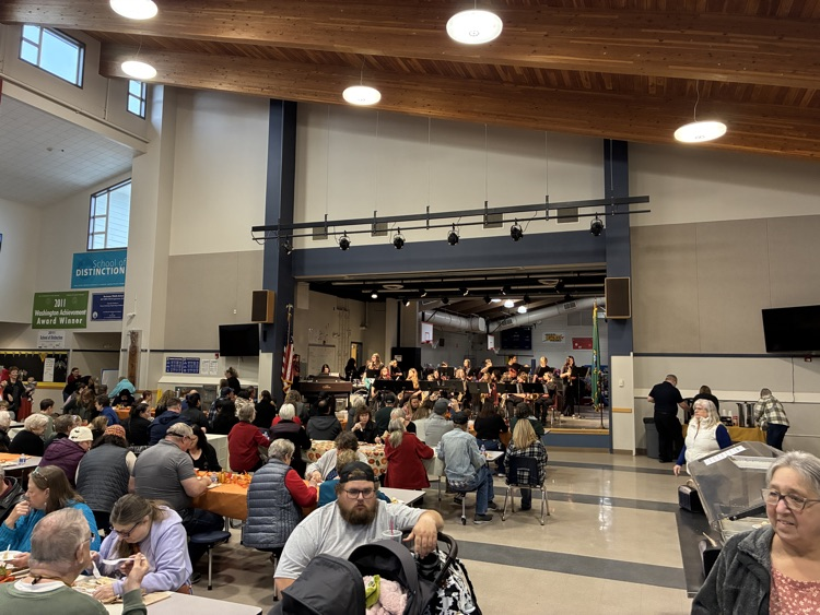 community members enjoying the thanksgiving meal and entertainment