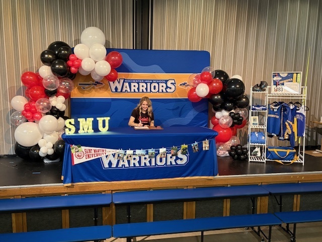 Girl looking down at table