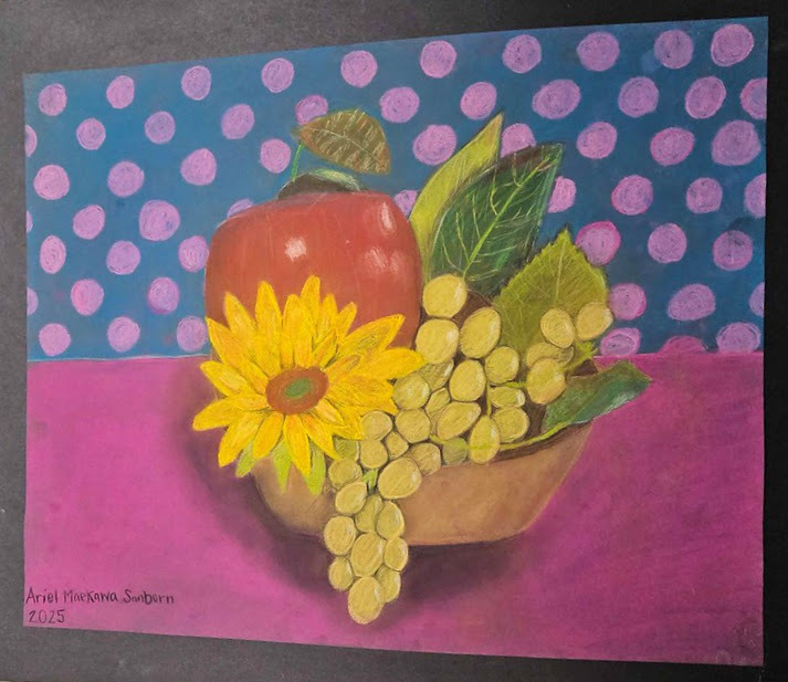 Picture of a bowl of a flower,, fruit and leaves.